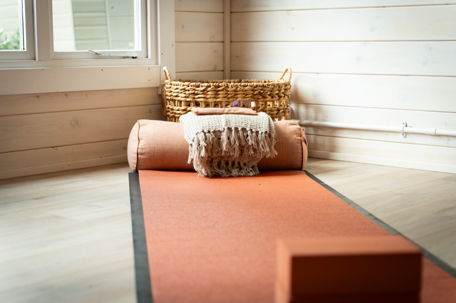 Bolster and blanket in the corner of the studio